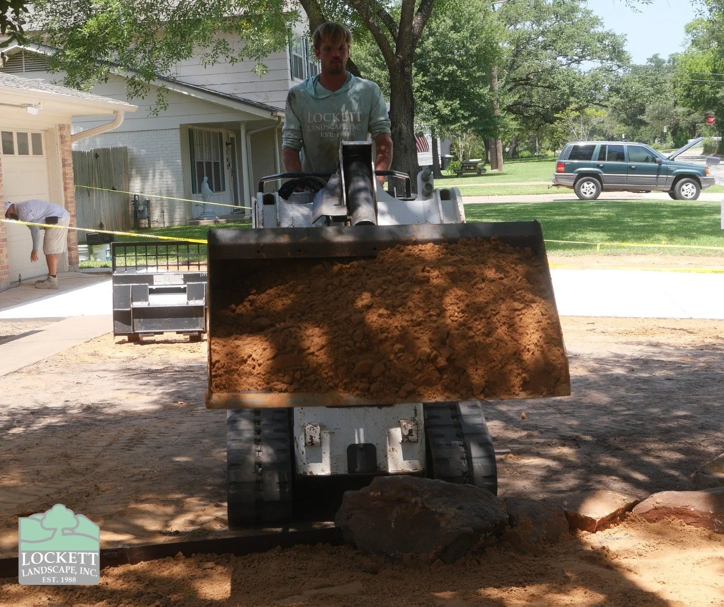 Here are some in progress picture from a recent project of ours. The summer heat is definitely brutal, but it feels slightly less brutal when you get to use heavy machinery like the front-end loader. We're excited to share completed project pictures 